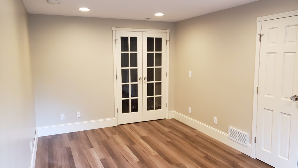 Double French glass doors in a bedroom.