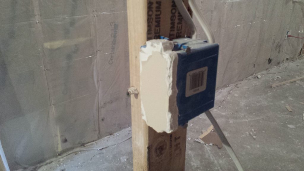 A junction box that was hidden behind drywall.